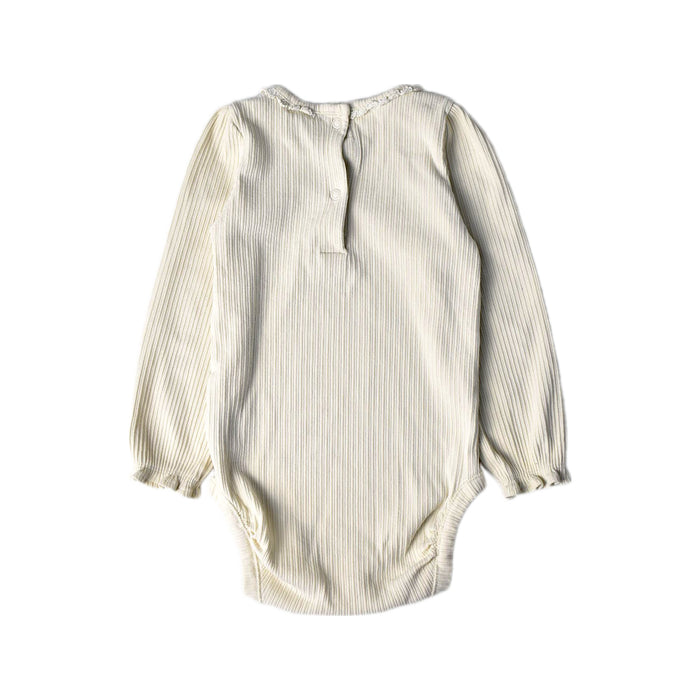 A Ivory Long Sleeve Bodysuits from Newbie in size 12-18M for girl. (Back View)