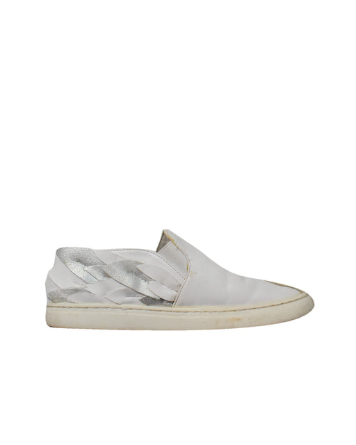 A White Slip Ons from Charles & Keith in size 6T for girl. (Front View)