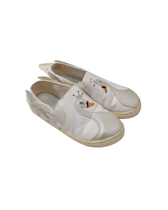 A White Slip Ons from Charles & Keith in size 6T for girl. (Front View)