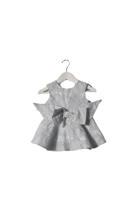 A White Sleeveless Dresses from bloomB in size 6-12M for girl. (Front View)