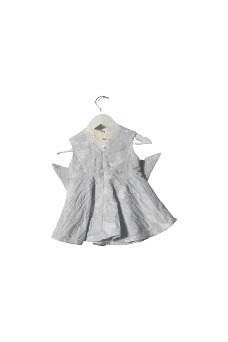 A White Sleeveless Dresses from bloomB in size 6-12M for girl. (Front View)