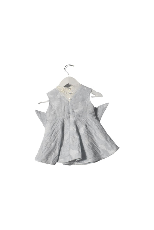 A White Sleeveless Dresses from bloomB in size 6-12M for girl. (Front View)