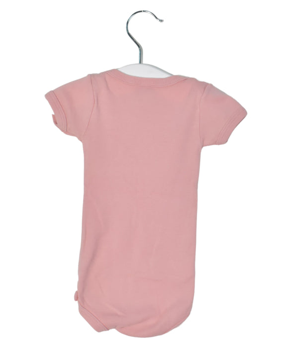 A Pink Short Sleeve Bodysuits from Petit Bateau in size 0-3M for girl. (Front View)