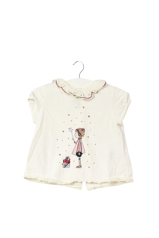 A White Short Sleeve Tops from Nanos in size 6-12M for girl. (Front View)
