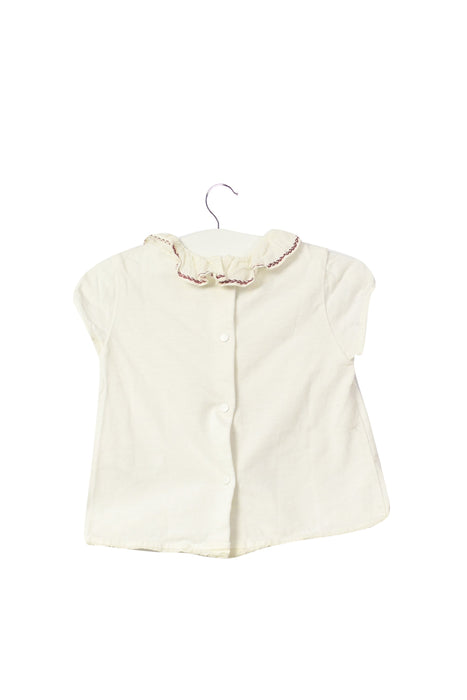 A White Short Sleeve Tops from Nanos in size 6-12M for girl. (Back View)