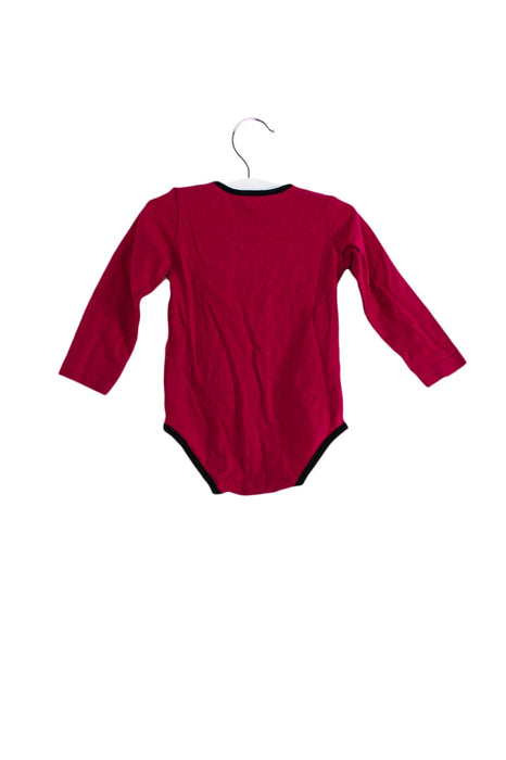 A Pink Long Sleeve Bodysuits from Gucci in size 6-12M for girl. (Front View)