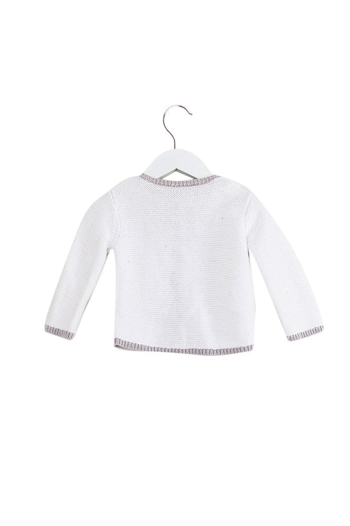 A White Cardigans from Jacadi in size 6-12M for girl. (Front View)