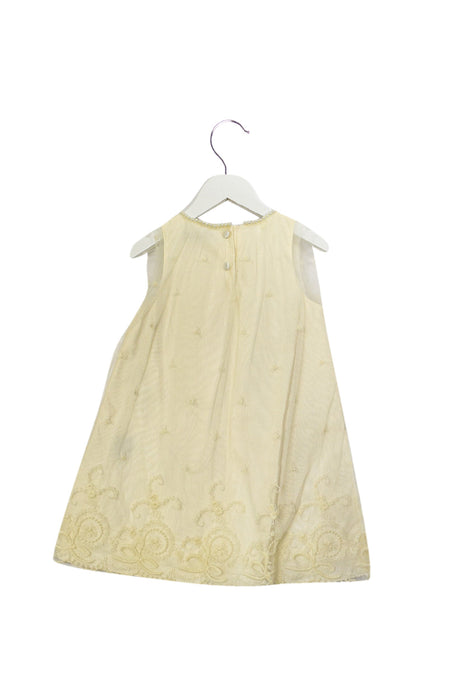 A Ivory Sleeveless Dresses from Fleurisse in size 4T for girl. (Back View)