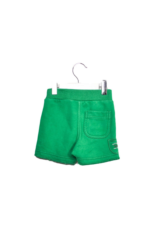 A Green Shorts from Diesel in size 0-3M for girl. (Front View)