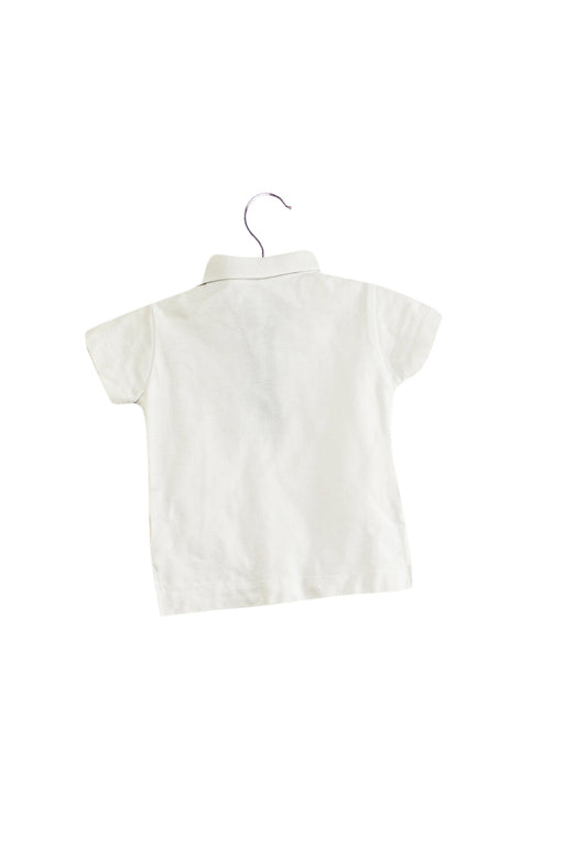 A White Short Sleeve Polos from Laranjinha in size 0-3M for boy. (Front View)