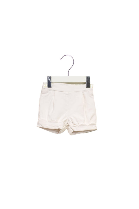 A White Shorts from Jacadi in size 6-12M for girl. (Front View)