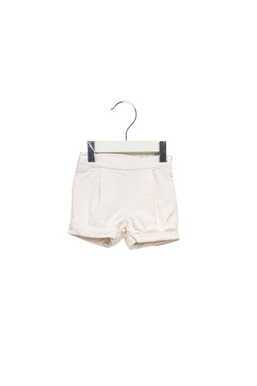 A White Shorts from Jacadi in size 6-12M for girl. (Front View)