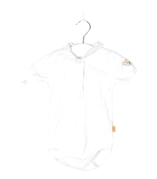 A White Bodysuits from Steiff in size 0-3M for neutral. (Front View)