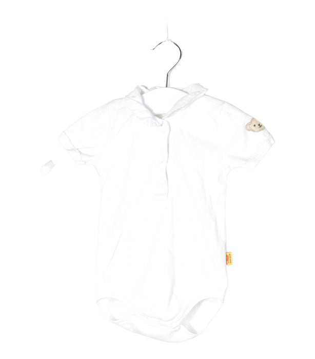A White Bodysuits from Steiff in size 0-3M for neutral. (Front View)