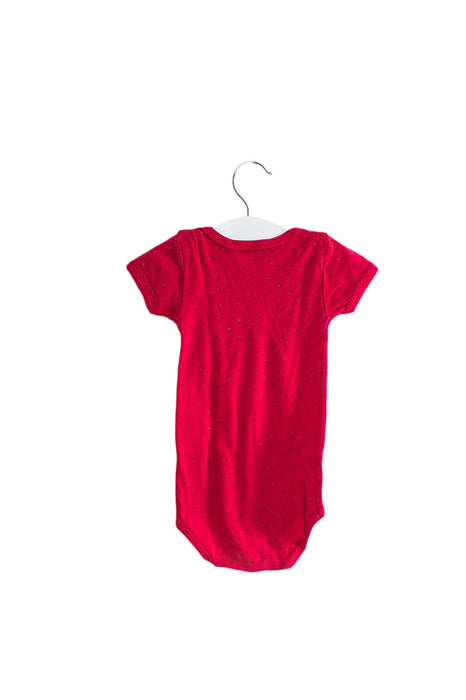 A Pink Short Sleeve Bodysuits from Petit Bateau in size 6-12M for girl. (Front View)