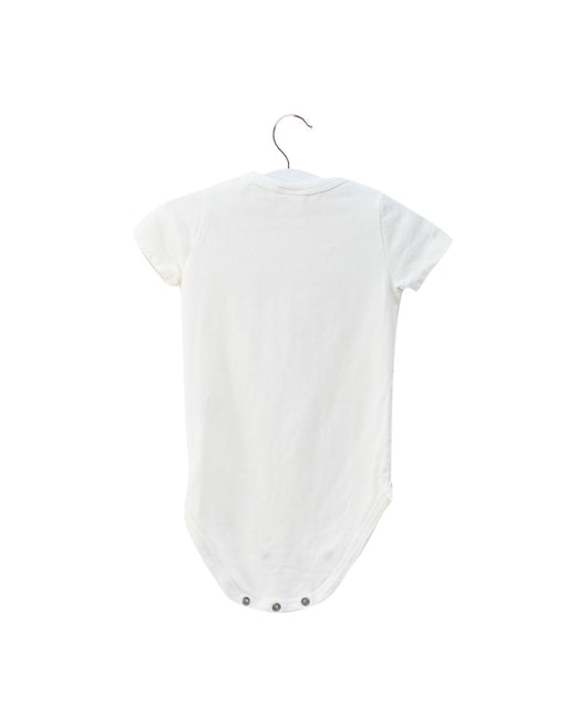 A Ivory Short Sleeve Bodysuits from Seed in size 3-6M for girl. (Front View)