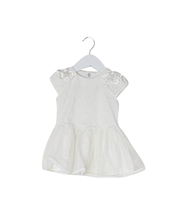 A White Sleeveless Tops from Miniclasix in size 12-18M for girl. (Front View)