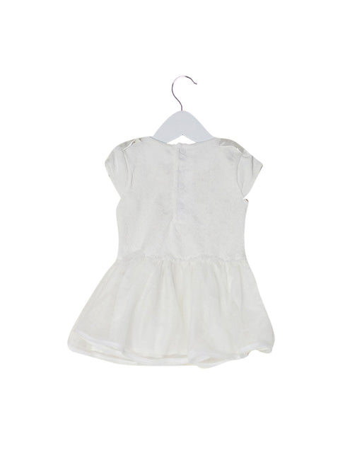 A White Sleeveless Tops from Miniclasix in size 12-18M for girl. (Front View)