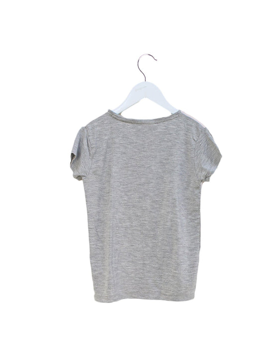 A Pink Short Sleeve T Shirts from Molo in size 6T for girl. (Front View)