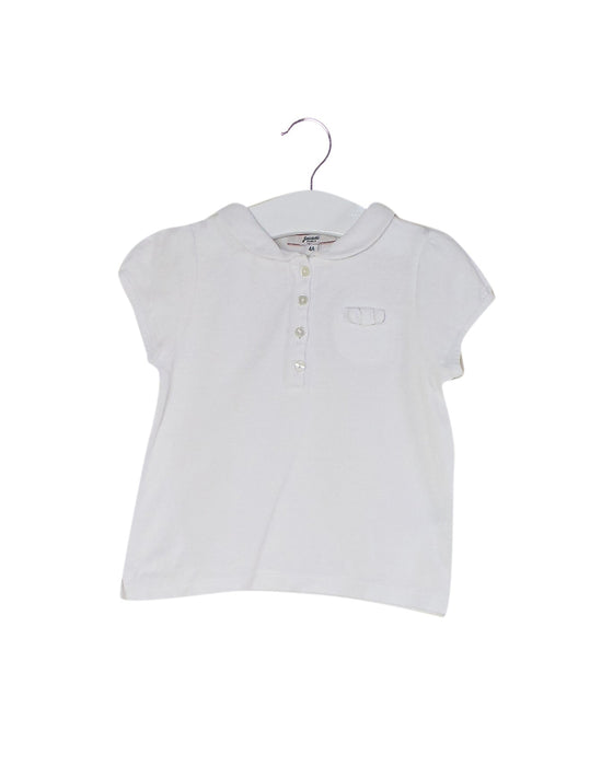 A White Short Sleeve Polos from Jacadi in size 4T for girl. (Front View)