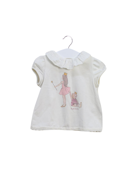 A Ivory Short Sleeve Tops from Nanos in size 6-12M for girl. (Front View)