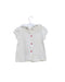 A Ivory Short Sleeve Tops from Nanos in size 6-12M for girl. (Front View)