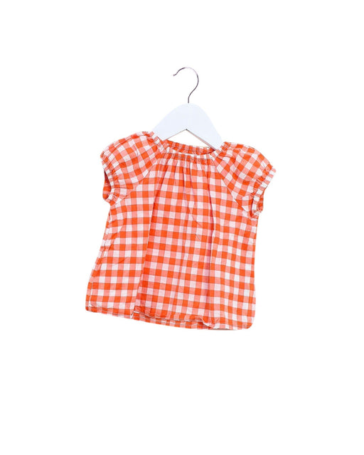 A Orange Short Sleeve Tops from DPAM in size 3-6M for girl. (Front View)