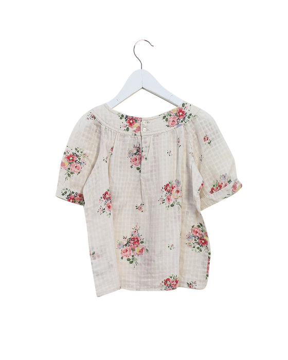 A Ivory Short Sleeve Tops from Bonpoint in size 4T for girl. (Back View)