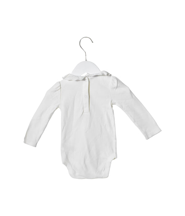 A White Long Sleeve Bodysuits from Boden in size 6-12M for girl. (Back View)