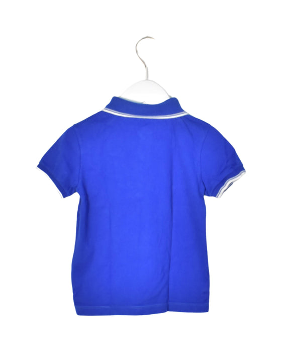 A Blue Short Sleeve Polos from Petit Bateau in size 6T for boy. (Back View)