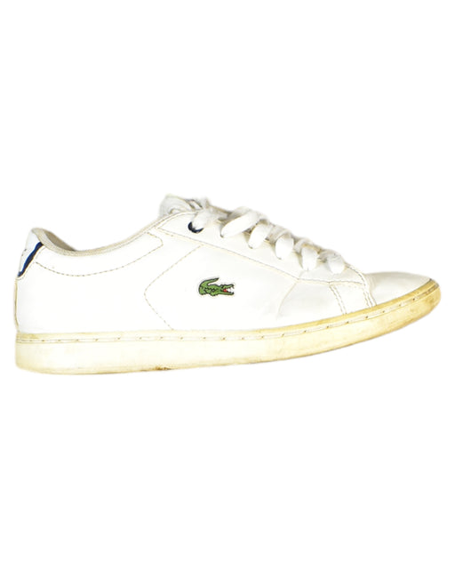 A White Sneakers from Lacoste in size 7Y for boy. (Front View)