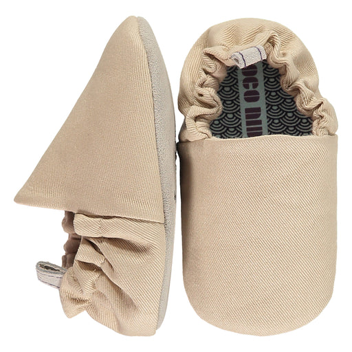 A Beige Slip Ons from Poco Nido in size 18-24M for neutral. (Front View)