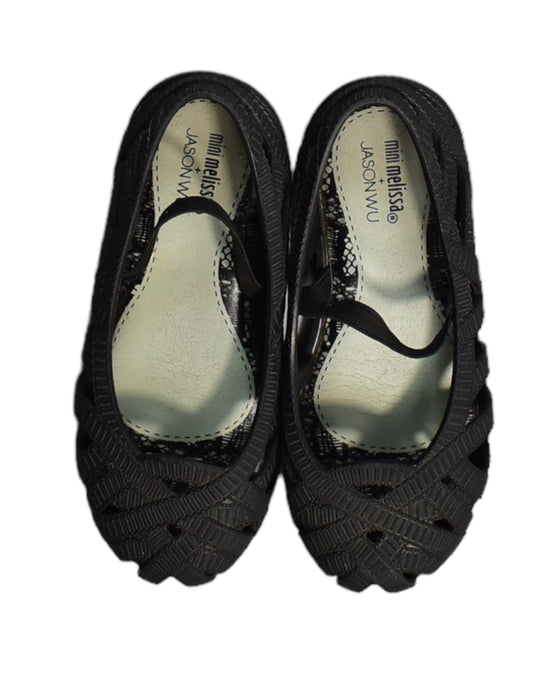 A Black Flats from Mini Melissa in size 4T for girl. (Back View)