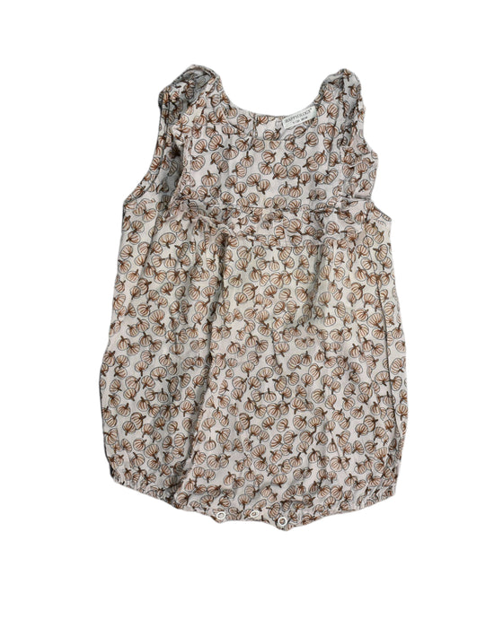 A White Rompers from Happyology in size 6-12M for girl. (Front View)