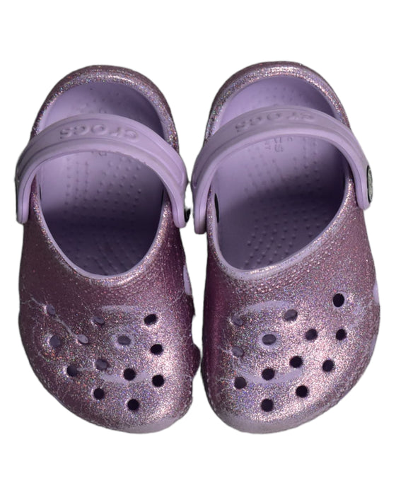 A Purple Sandals from Crocs in size 3T for girl. (Back View)